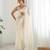 Cream georgette sequins saree with unstitched blouse piece.