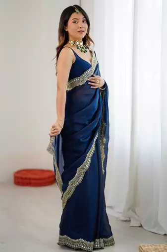 Navy blue tissue satin sequins saree with unstitched blouse piece.