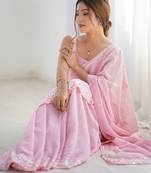 Pink georgette sequins saree with unstitched blouse piece.