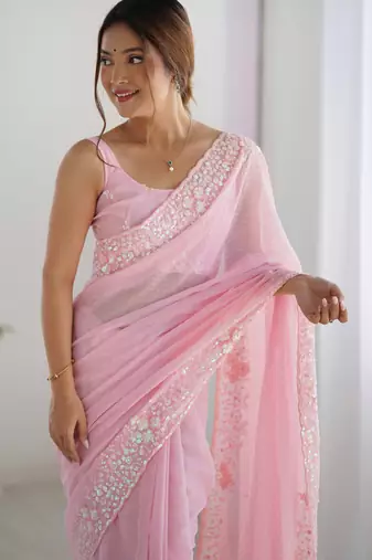 Pink georgette sequins saree with unstitched blouse piece.