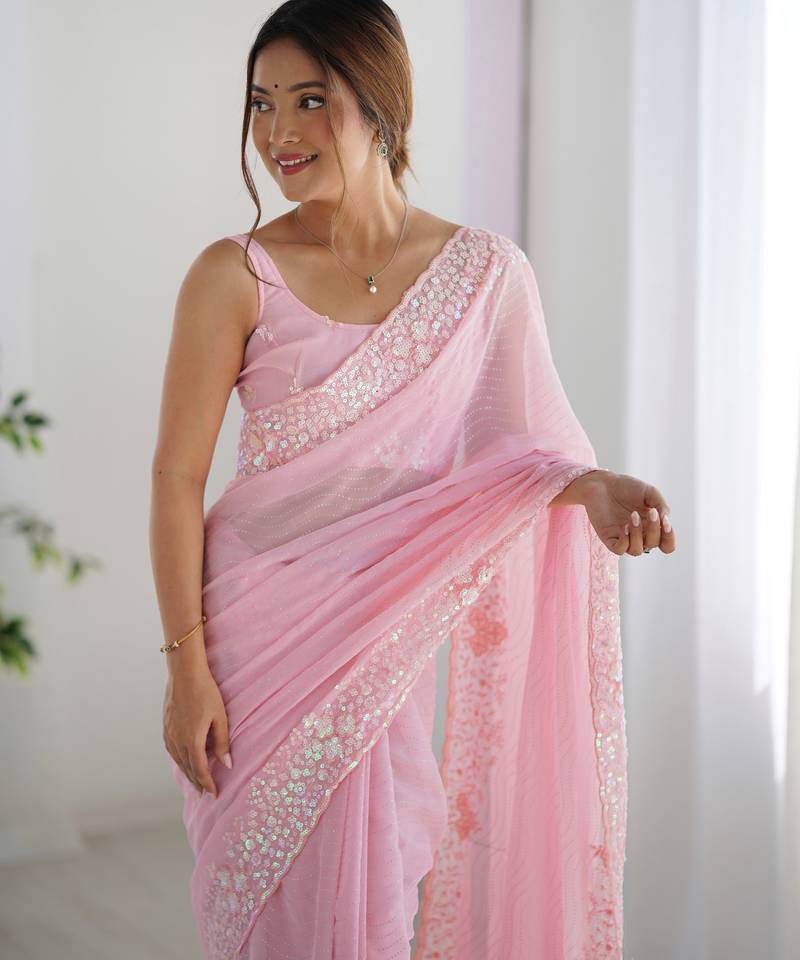 Pink georgette sequins saree with unstitched blouse piece.