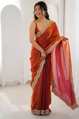 Orange tissue satin sequins saree with unstitched blouse piece.