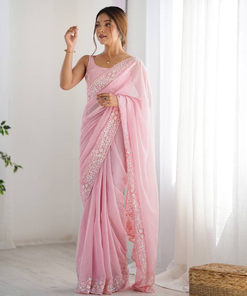 Pink georgette sequins saree with unstitched blouse piece.