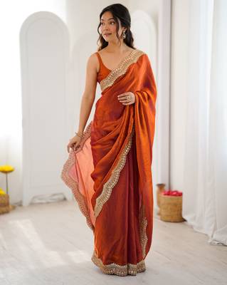 Orange tissue satin sequins saree with unstitched blouse piece. 3
