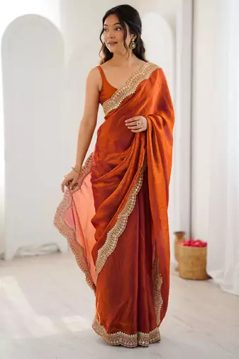 Orange tissue satin sequins saree with unstitched blouse piece.
