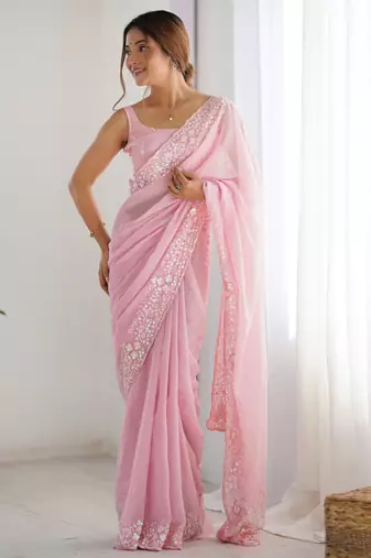 Pink georgette sequins saree with unstitched blouse piece.