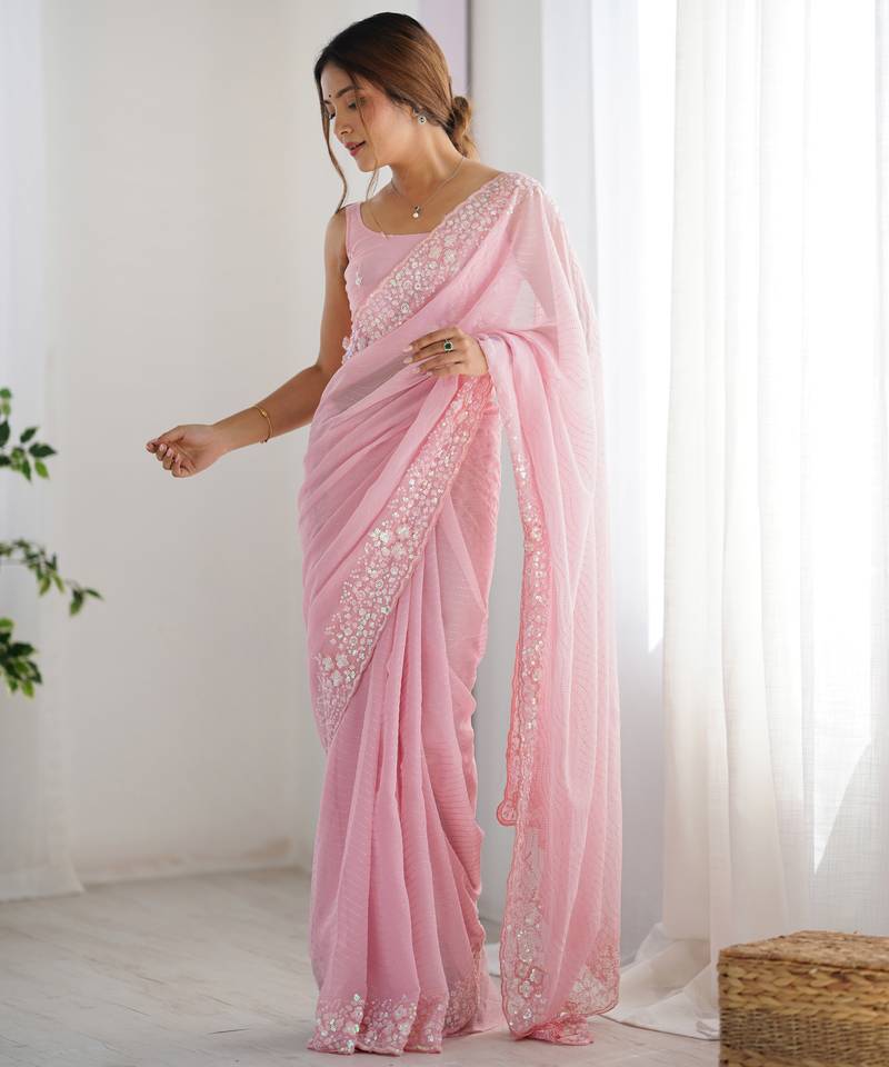Pink georgette sequins saree with unstitched blouse piece.