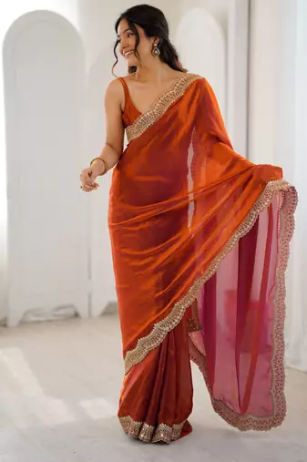 Orange tissue satin sequins saree with unstitched blouse piece.