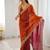 Orange tissue satin sequins saree with unstitched blouse piece.