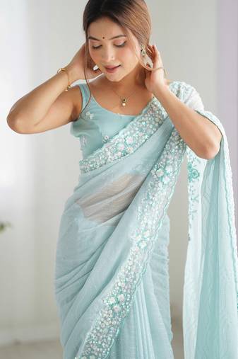 Sky blue georgette sequins saree with unstitched blouse piece.