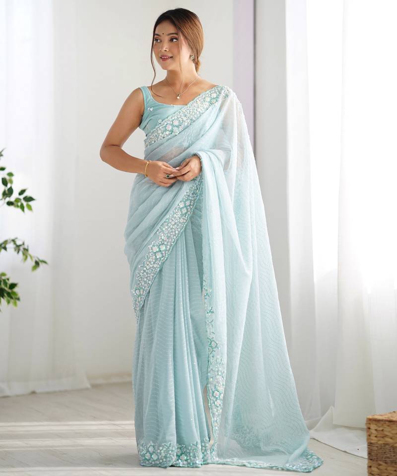 Sky blue georgette sequins saree with unstitched blouse piece.