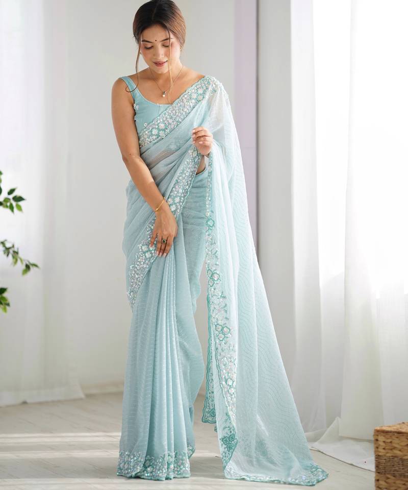 Sky blue georgette sequins saree with unstitched blouse piece.