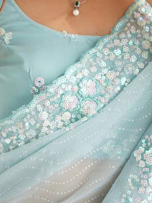 Sky blue georgette sequins saree with unstitched blouse piece. 4