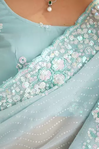 Sky blue georgette sequins saree with unstitched blouse piece.