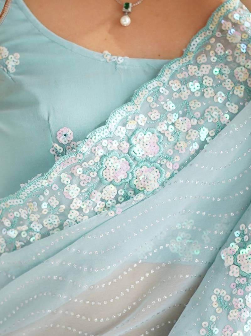 Sky blue georgette sequins saree with unstitched blouse piece.