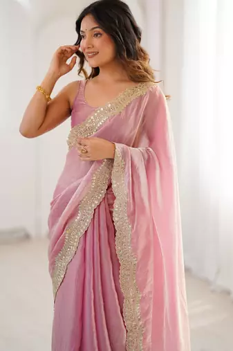 Pink tissue satin sequins saree with unstitched blouse piece.