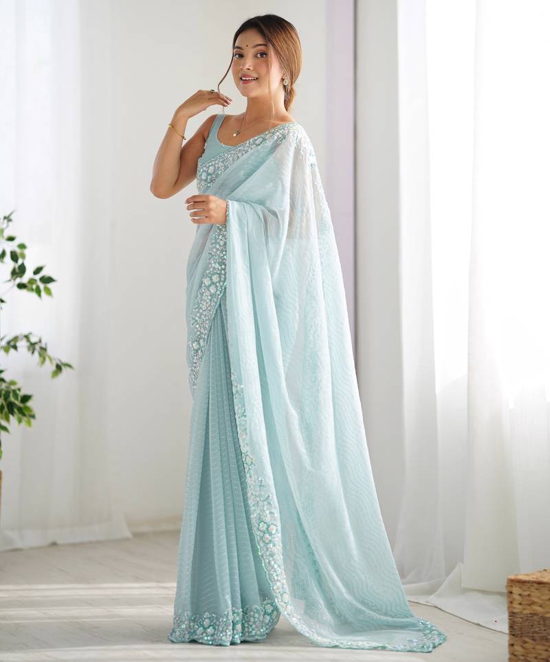 Sky blue georgette sequins saree with unstitched blouse piece.