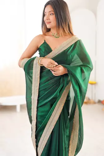 Green tissue satin solid saree with unstitched blouse piece.