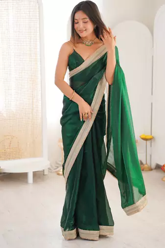 Green tissue satin solid saree with unstitched blouse piece.