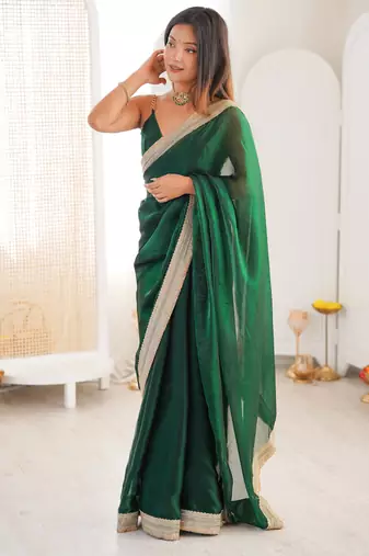 Green tissue satin solid saree with unstitched blouse piece.