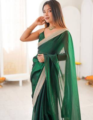 Green tissue satin solid saree with unstitched blouse piece. 4