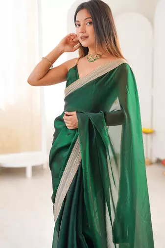 Green tissue satin solid saree with unstitched blouse piece.