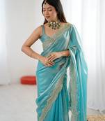 Sky blue tissue satin sequins saree with unstitched blouse piece.