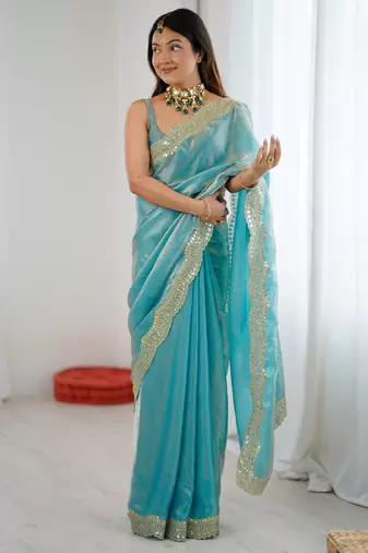 Sky blue tissue satin sequins saree with unstitched blouse piece.