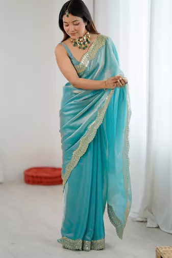 Sky blue tissue satin sequins saree with unstitched blouse piece.