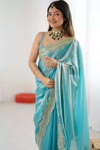 Sky blue tissue satin sequins saree with unstitched blouse piece.