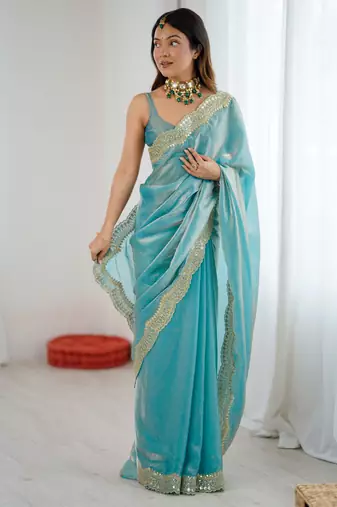 Sky blue tissue satin sequins saree with unstitched blouse piece.
