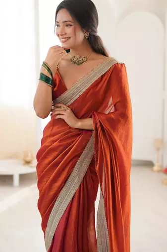 Oeange tissue satin solid saree with unstitched blouse piece.