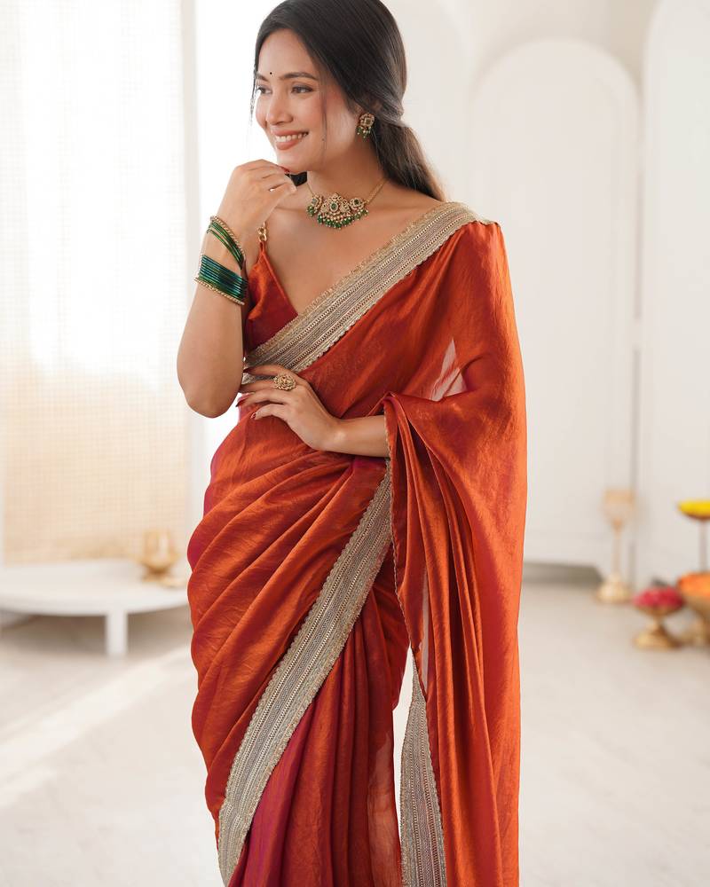 Oeange tissue satin solid saree with unstitched blouse piece.