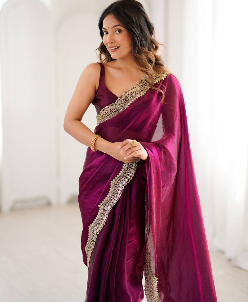 Wine tissue satin sequins saree with unstitched blouse piece.