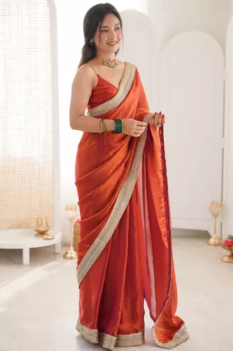 Oeange tissue satin solid saree with unstitched blouse piece.