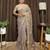 Beige tissue satin embroidered saree with unstitched blouse piece.