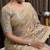 Beige tissue satin embroidered saree with unstitched blouse piece.