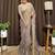 Beige tissue satin embroidered saree with unstitched blouse piece.