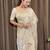 Cream tissue satin embroidered saree with unstitched blouse piece.