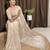 Cream tissue satin embroidered saree with unstitched blouse piece.