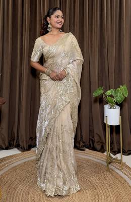 Cream tissue satin embroidered saree with unstitched blouse piece. 4