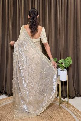 Cream tissue satin embroidered saree with unstitched blouse piece. 5