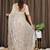 Cream tissue satin embroidered saree with unstitched blouse piece.