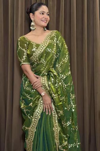 Green tissue satin embroidered saree with unstitched blouse piece.