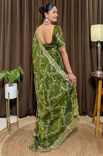 Green tissue satin embroidered saree with unstitched blouse piece.