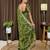 Green tissue satin embroidered saree with unstitched blouse piece.