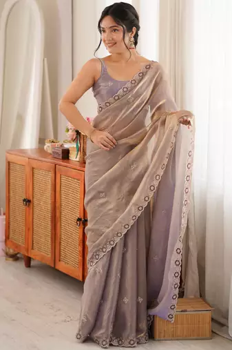 Grey tissue satin embroidered saree with unstitched blouse piece.
