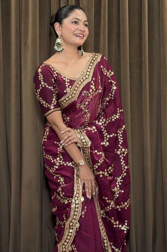 Wine tissue satin embroidered saree with unstitched blouse piece.
