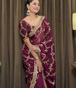 Wine tissue satin embroidered saree with unstitched blouse piece.