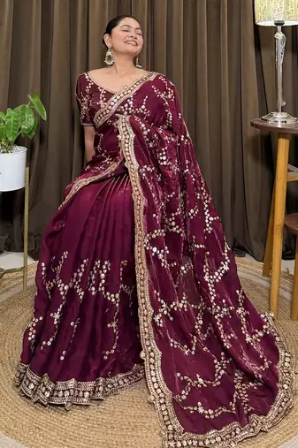 Wine tissue satin embroidered saree with unstitched blouse piece.